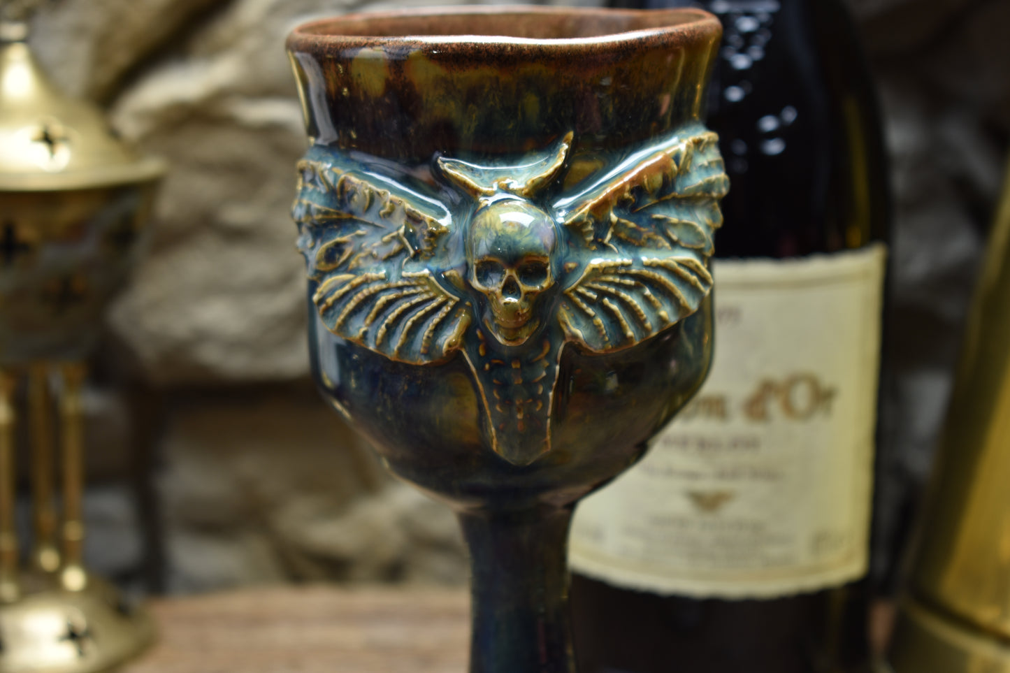 Handmade ceramic wine goblet with deathmoth - blue/brown effect glaze
