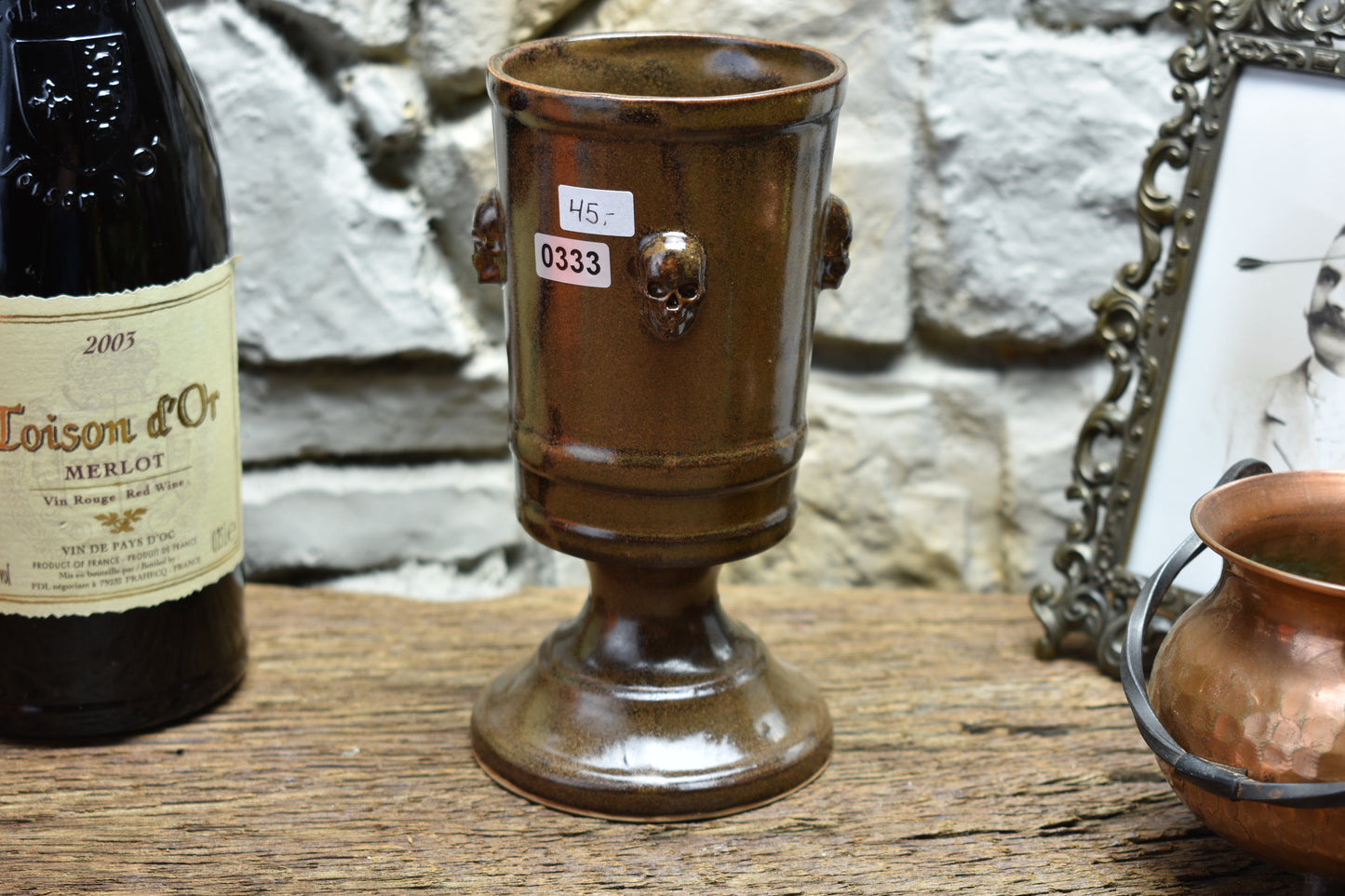 Handmade ceramic chalice with skulls - brown