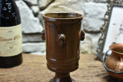 Handmade ceramic chalice with skulls - brown