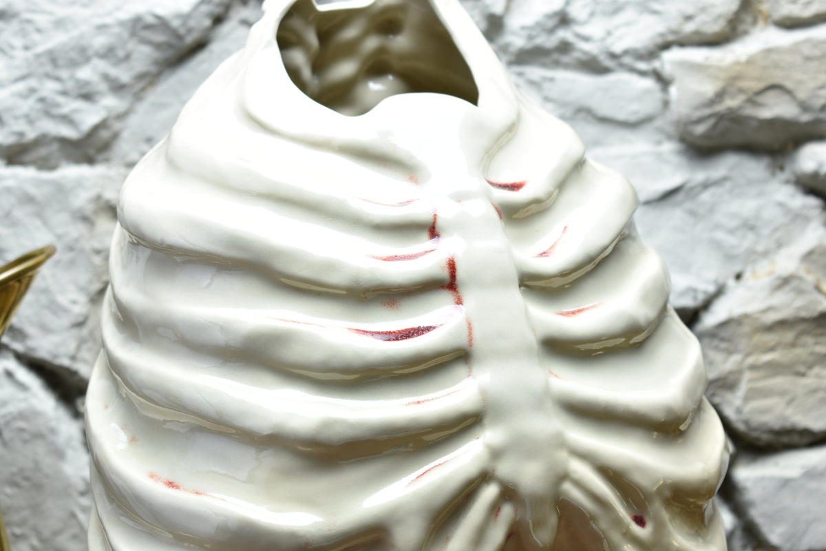 Handmade ribcage vase shiny white and bloody effect glaze