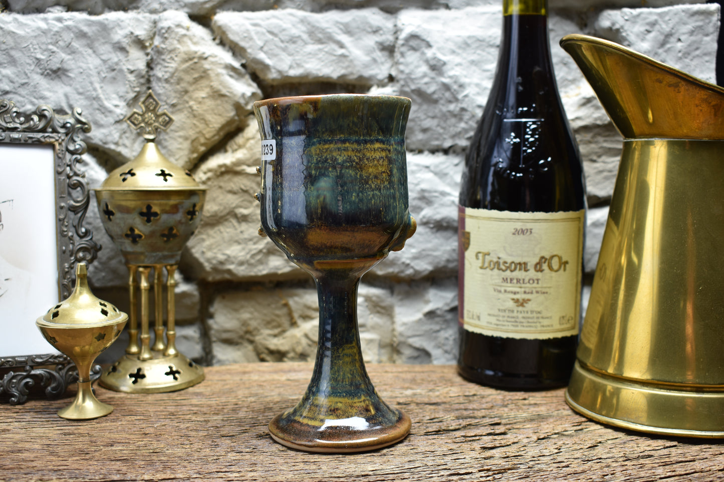 Handmade ceramic wine goblet with skeleton hand - brown/blue effect glaze