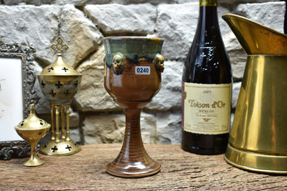 Handmade ceramic wine goblet with skulls - brown & effect glaze