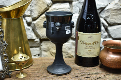 Handmade ceramic wine goblet with skulls - black/shinyblack effect