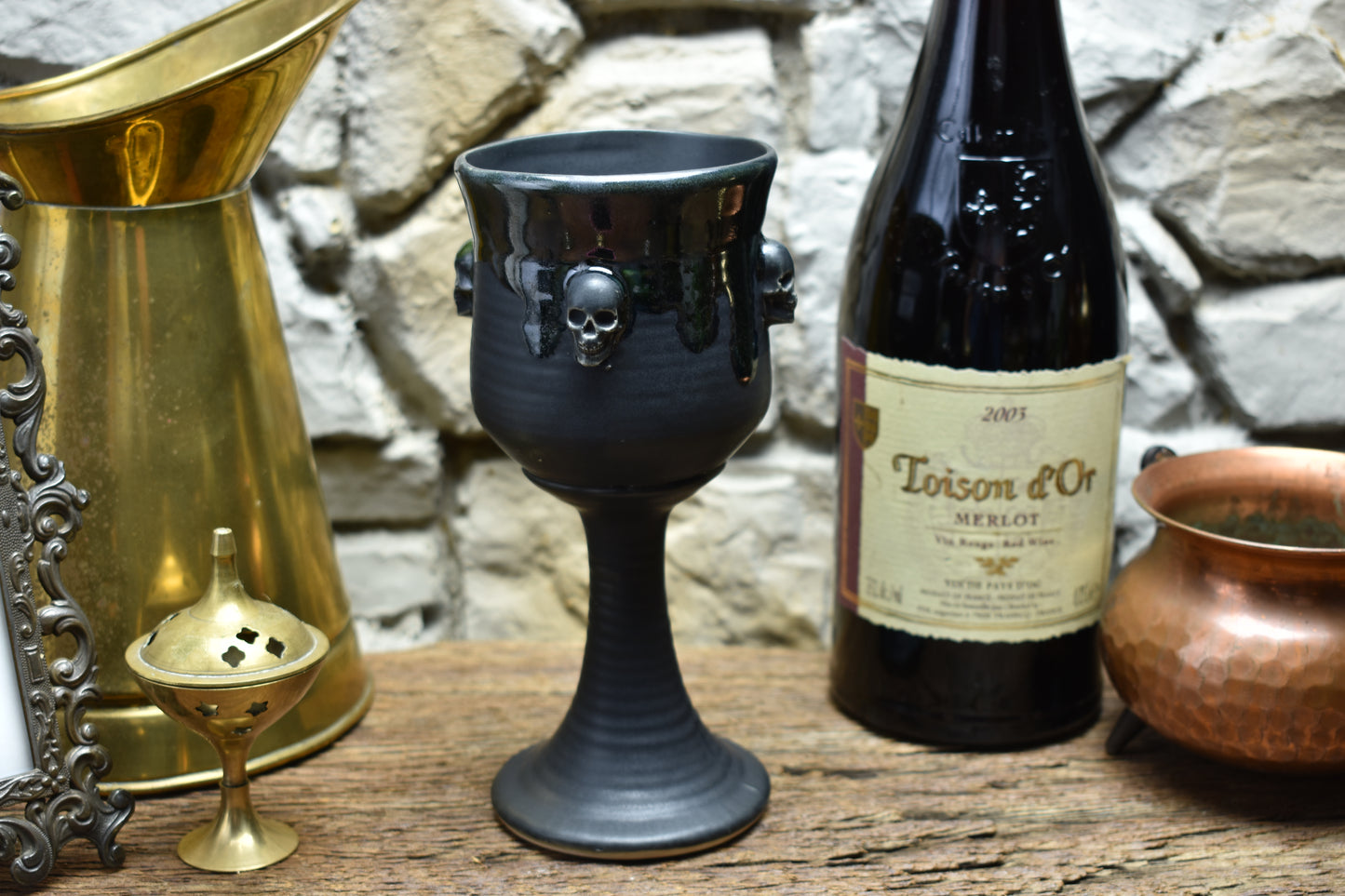 Handmade ceramic wine goblet with skulls - black/shinyblack effect