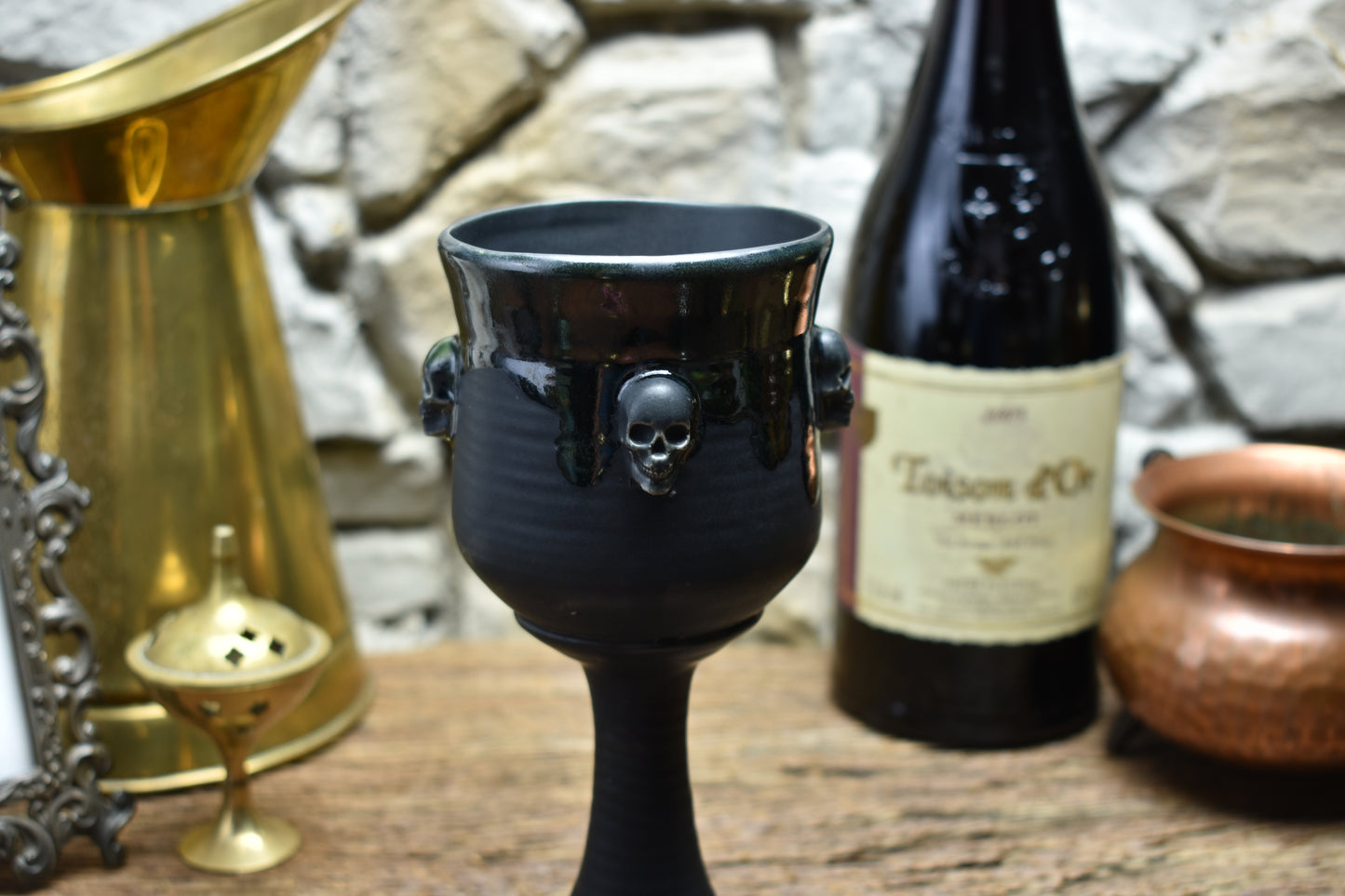 Handmade ceramic wine goblet with skulls - black/shinyblack effect