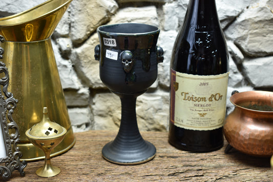 Handmade ceramic wine goblet with skulls - black/shiny black
