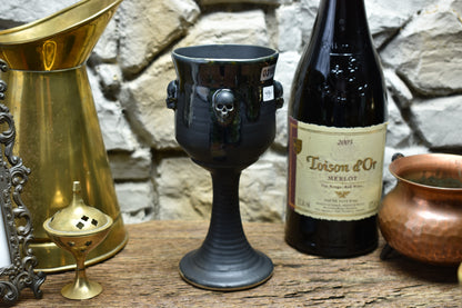 Handmade ceramic wine goblet with skulls - black/shiny black