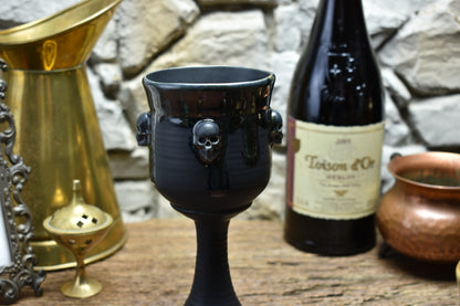 Handmade ceramic wine goblet with skulls - black/shiny black