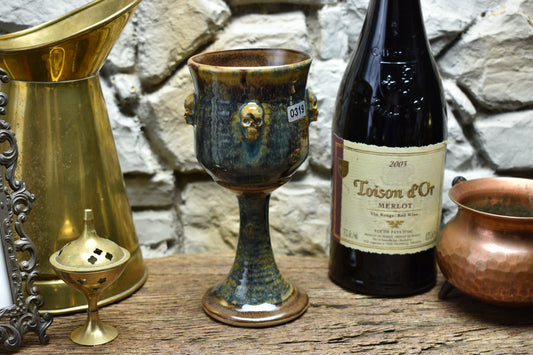 Handmade ceramic wine goblet with skulls - brown/blue/green effect glaze