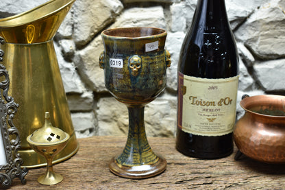 Handmade ceramic wine goblet with skulls - brown/blue/green effect glaze