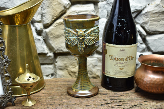 Handmade ceramic wine goblet with deathmoth - brown/green effect glaze