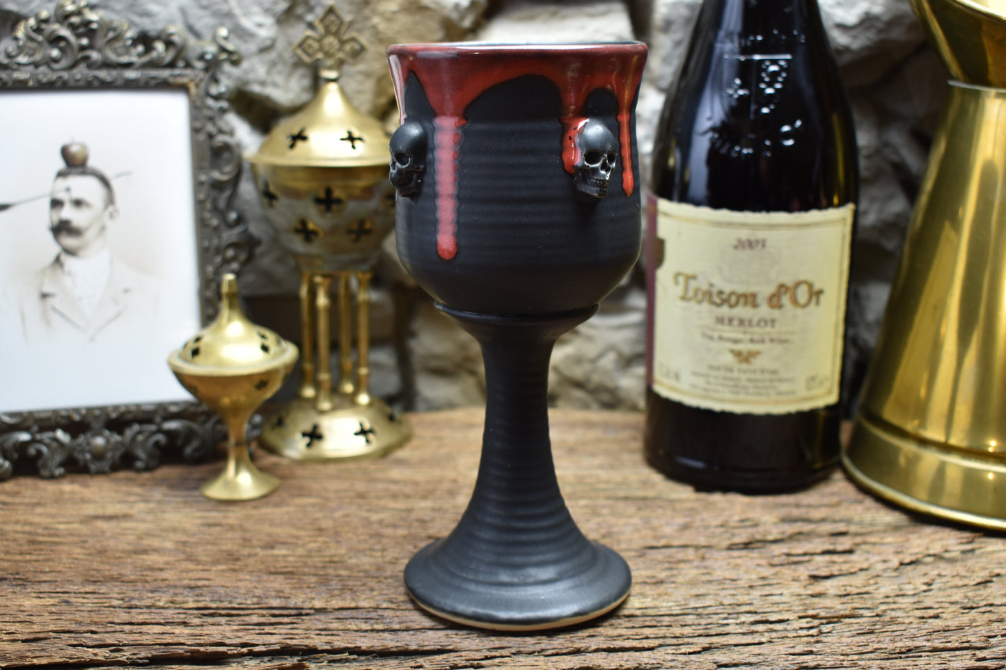 Handmade ceramic wine goblet with skulls - matt black & red