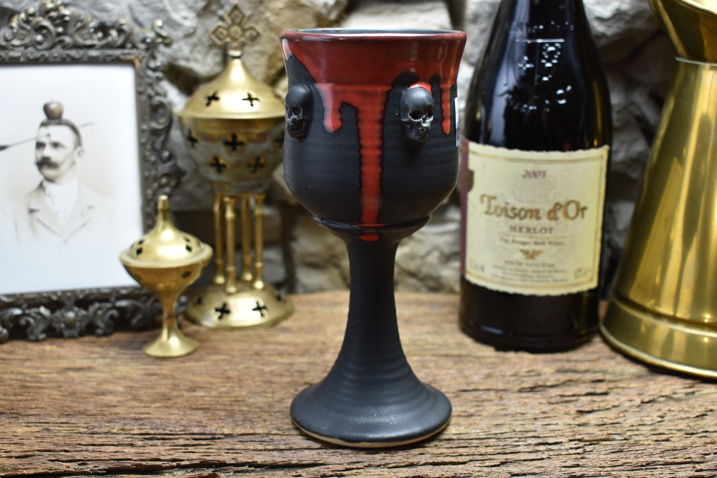 Handmade ceramic wine goblet with skulls - matt black & red