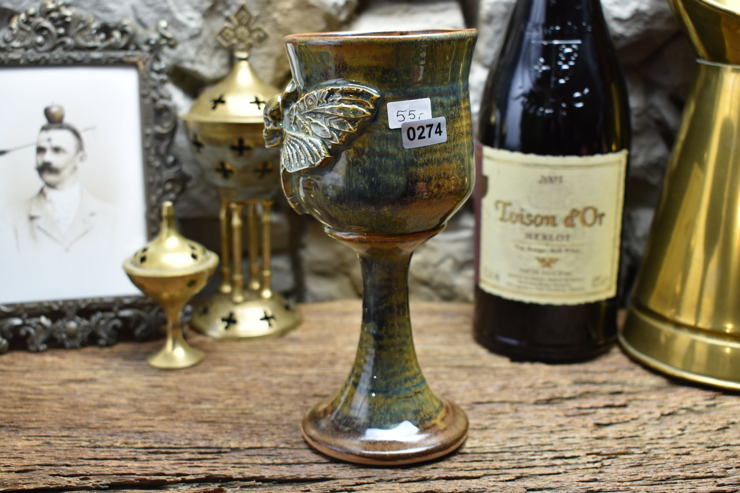 Handmade ceramic wine goblet with deathmoth - brown/green effect glaze