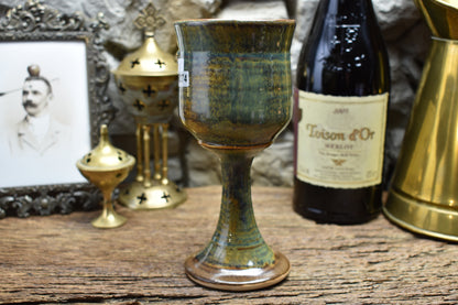 Handmade ceramic wine goblet with deathmoth - brown/green effect glaze