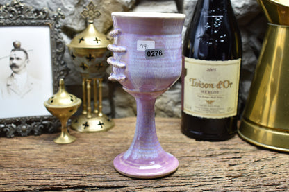 Handmade ceramic wine goblet with skeleton hand - lilac effect glaze