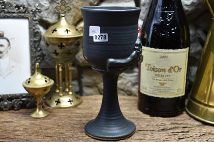 Handmade ceramic wine goblet with skeleton hand - black matt & red glaze
