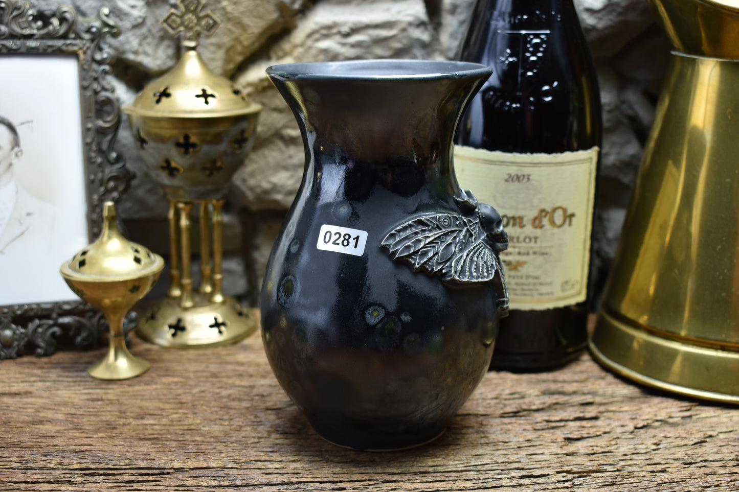 Handmade small vase with deathmoth - black shiny effect glaze
