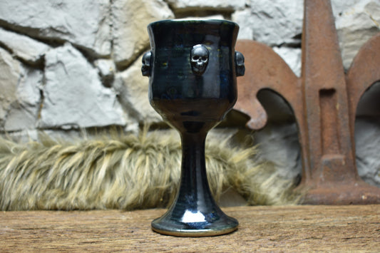 Handmade ceramic wine goblet with skulls - black effect glaze