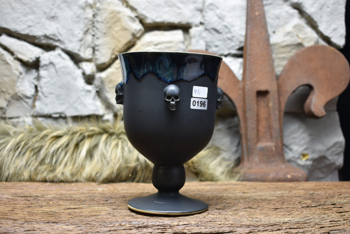 Handmade ceramic grail with skulls - black effect glaze