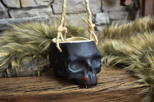 Small hanging skull plantpot black matt with red vampire teeth