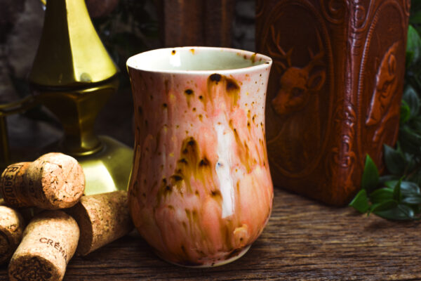 Handmade ceramic cup with shiny pink effect glaze