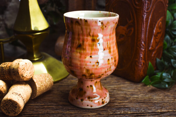 Handmade ceramic goblet with shiny pink effect glaze