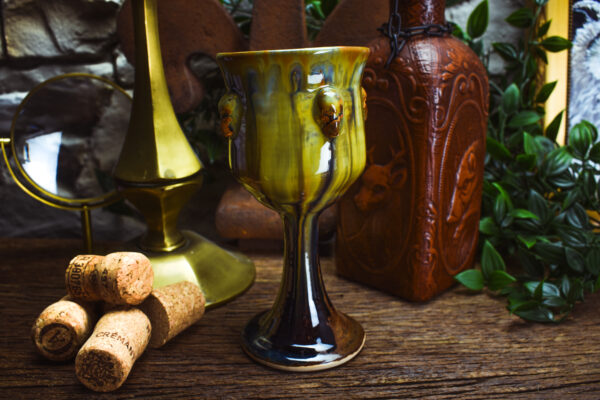 Handmade ceramic wine goblet with skulls and brown effect glaze - Image 3