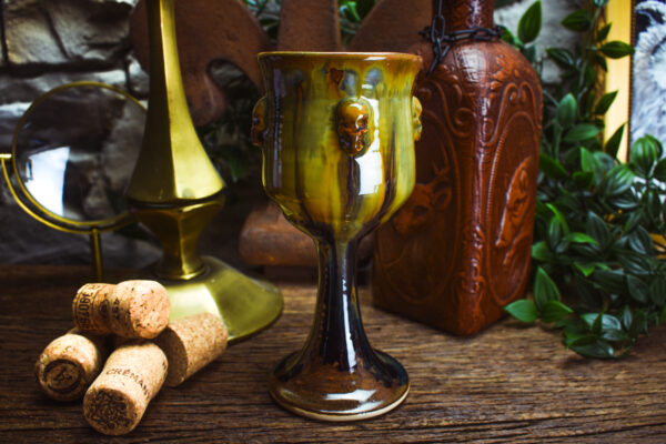 Handmade ceramic wine goblet with skulls and brown effect glaze - Image 2