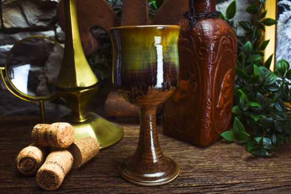 Handmade ceramic wine goblet with matt brown and shiny effect glaze