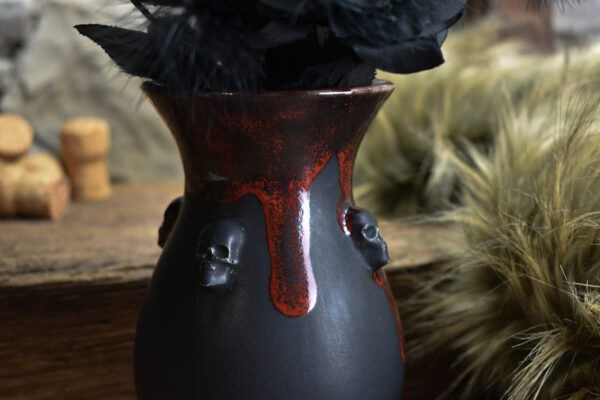 Handmade small vase with skulls black matt and red effect