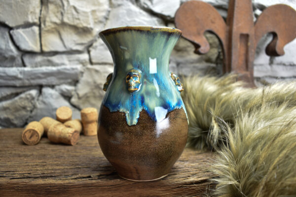 Handmade small vase with skulls brown/blue effect glaze