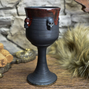 Handmade ceramic wine goblet with skulls black matt and red effect