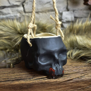 Small hanging skull plantpot black matt with red vampire teeth