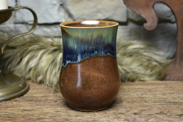 Handmade ceramic cup with matt brown and blue effect glaze