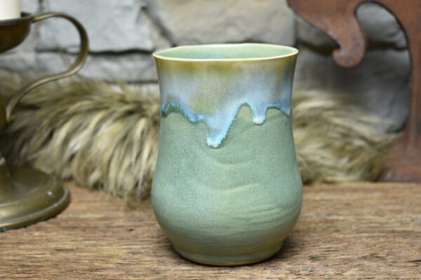Handmade ceramic cup with green matt and effect glaze