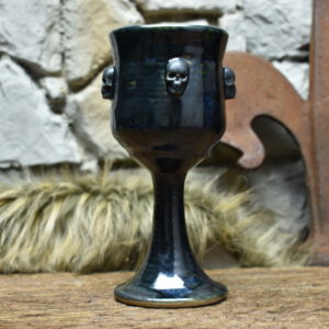 Handmade ceramic wine goblet with skulls - black effect glaze