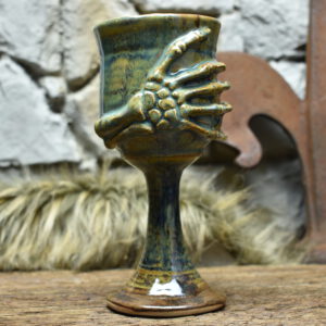 Handmade ceramic wine goblet with skeleton hand - brown effect glaze